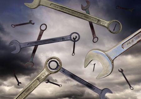 Spanners falling from stormy sky - its rainingの写真素材