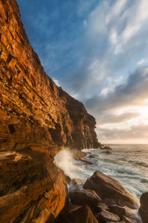 a rocky mountain on the coastlineの写真素材