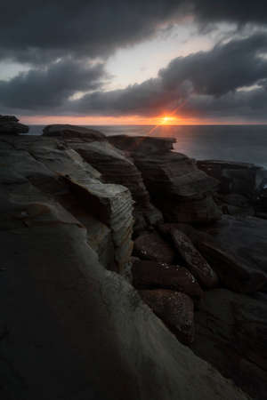 a rocky landscape with a body of waterの写真素材