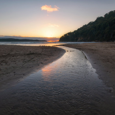 a sunset over a body of waterの写真素材