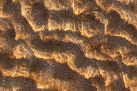 patterns in the water at the beachの写真素材