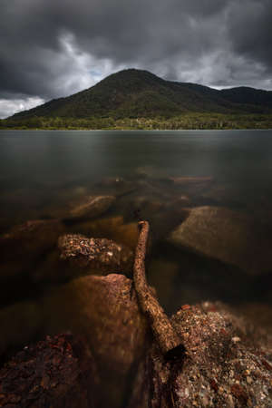 a view of a mountain with rocks in foregroundの写真素材