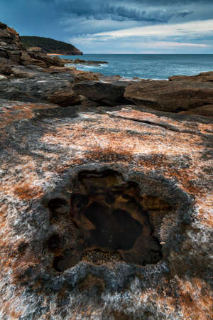 unique colours on the rocks on the coastlineの写真素材