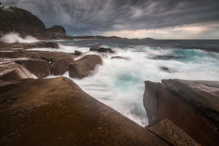 rough water conditions in the ocean along the coastlineの写真素材