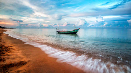 a boat on a body of water at beachの写真素材