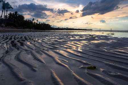 a view of a beach next to a body of waterの写真素材