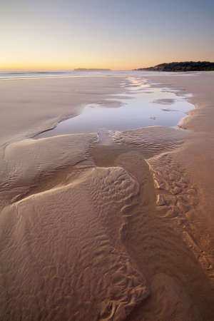 patterns in the sand at the beachの写真素材