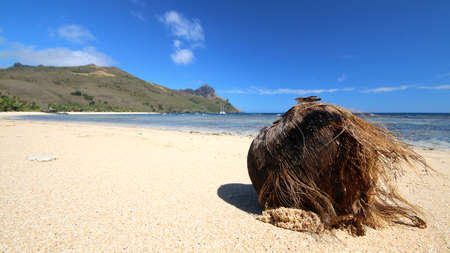 a rocky beach next to a body of water