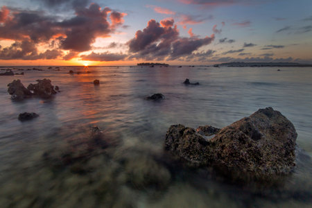 a sunset over a body of water on santo island in vanuatuの写真素材