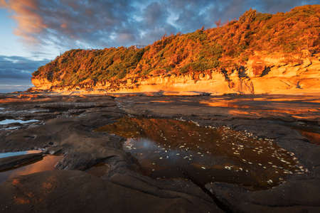 first light and rockpool at terrigal on nsw central coastの写真素材