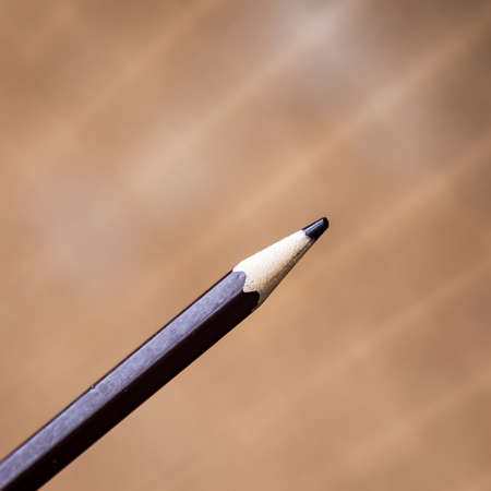 a close up of a brown pencil against a smooth backgroundの写真素材