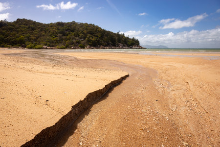 Geoffrey Bay beach next to a body of water on Magnetic Island in Townsvilleの写真素材