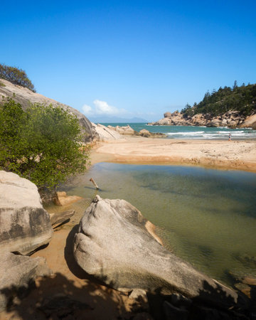 Rocks and aqua water at Alma Bay on Magnetic Island in Townsvilleの写真素材