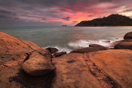 sunrise near radical bay on magnetic island with rocks and oceanの写真素材