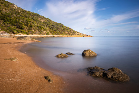 a rock island in the middle of a body of water at Townsvilleの写真素材