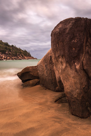Rocks and water on Balding Bay beach at Magnetic Islandの写真素材