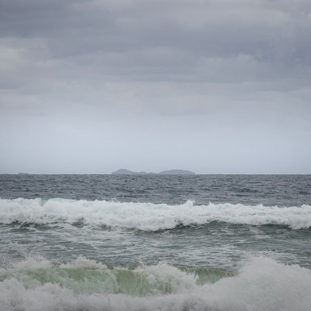 solitary islands from a stormy day at wooli beach on nsw north coastの写真素材