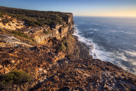 view from high cliffs at sunrise in bouddi national park nsw australiaの写真素材