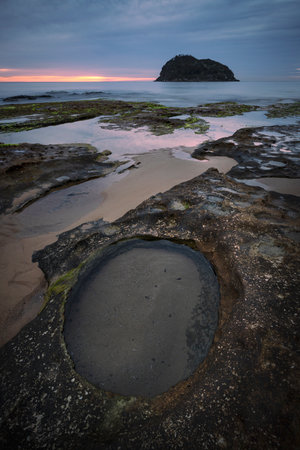 rock pools and water on overcast morning near lion island central coast nsw australiaの写真素材