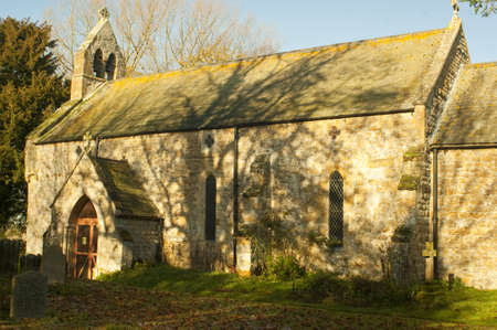 Dappled sunlight falls on All Saints Church  Which is to be  found in the tiny hamlet of Thorton-Le-Moor,North Lincolnshire  The village has three houses, a village church   All Saints   and Thornton Manor Farm のeditorial素材