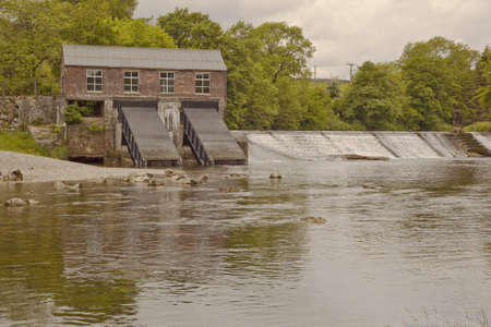 The hydro electic plant at Linton Falls, Grassington, Yorkshire was first built in 1909  In 2011 after falling into disrepair it was brought back into use by installing Archemedean screw turbines の写真素材