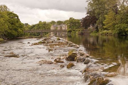 Looking down stream on the river Wharfe at Linton falls  Water flow is low due to a recent dry period の写真素材