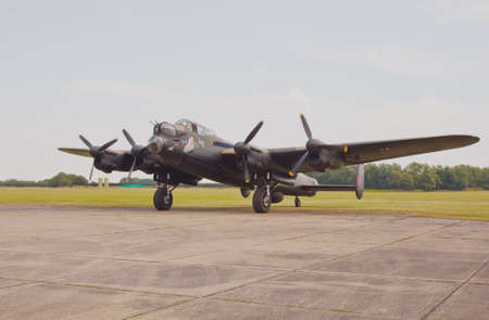Just Jane, a Lancaster bomber returns to base after giving a taxi run demonstration at a Lincolnshire air show.のeditorial素材