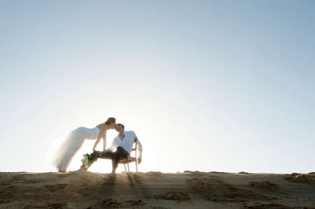 Young beautiful couple hanging out together at the beachの写真素材