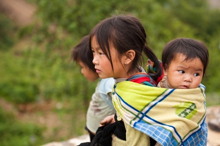 H'Mong girl carrying baby sisterのeditorial素材