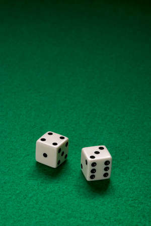 Pair of Dice on green felt tableの写真素材