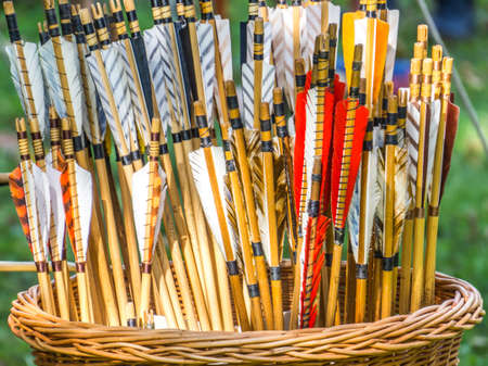 Ships of arrows for a bow in a plaited weasel basket, abstract shotの写真素材