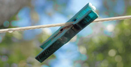 Abstract picture of an old clothespinの写真素材