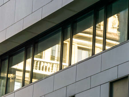 Modern facade of an administration building with reflections