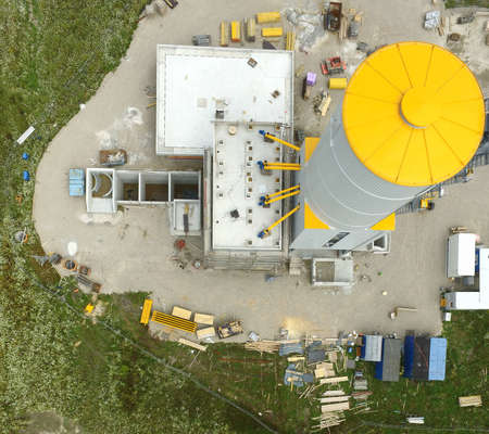 Construction site for an industrial plant for the production of concrete, taken vertically from the air, aerial view with a droneのeditorial素材