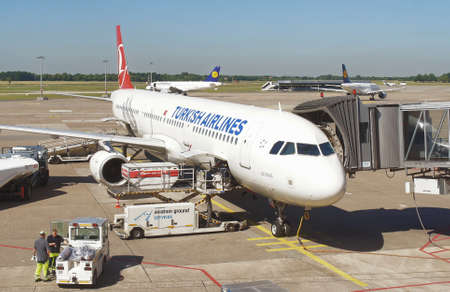 Hanover, Lower Saxony, Germany, July 1st 2015: Hanover Airport with Turkish aircraft while loading for the flight to Turkeyのeditorial素材