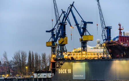 Hamburg, Germany, December 10th 2017: Container cranes at Dock 10 from Bohm and Voss at the port of Hamburg in the early morning.のeditorial素材