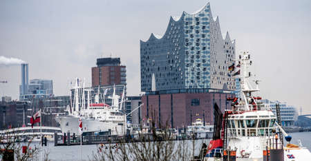 Hamburg, Germany, December 10th 2017: View from Hamburg harbour to the Elbphilharmonie concert hall over the harbour basin with ships on early Sunday morning.のeditorial素材