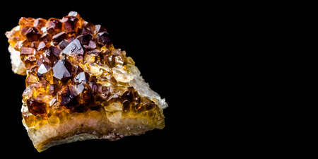 Stone with many crystals of quartz (smoke-quartz), isolated in front of black background with free...