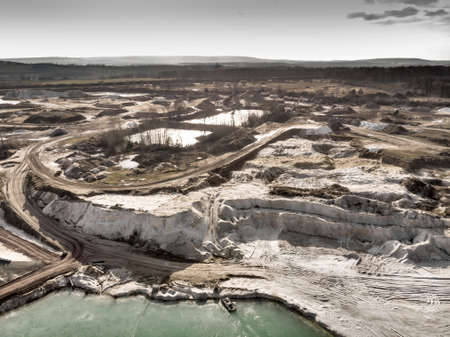 Aerial view of the edge of a large white sand quartz quarry, made with droneの写真素材