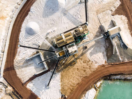 Aerial view of the processing plant with the sand fractionator at the edge of a quartz sand quarry pond for white quartz sand, made with droneの写真素材