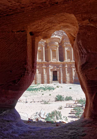 View through the rock window of a storage room in Petra to the monastery Al-deir, Jordanの写真素材