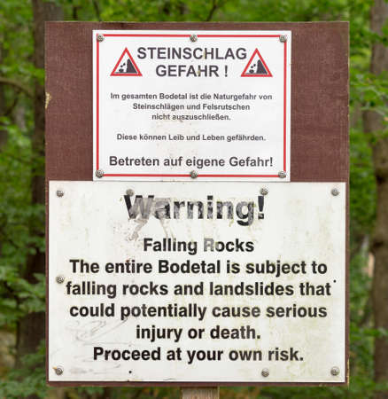 Warning sign of falling rocks and landslides at the entrance of the Bodetal near Thale, Harz. (German text identical to English text)のeditorial素材