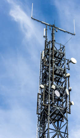 Antenna mast with many satellite shots, parabolants and directional antennas for listening,...