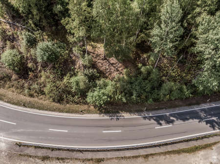 Aerial view of a lonely asphalted country road in the Harz Mountains