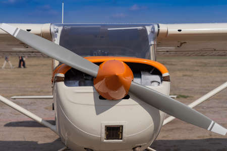 Front view of a single engine propeller aircraft.