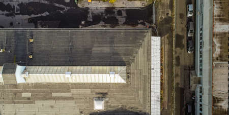 Vertical aerial photograph of an old industrial hall with a glass roof in the Firste, drone photographの写真素材