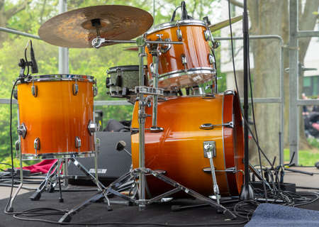Drums on a stage before a concert at a music festival.