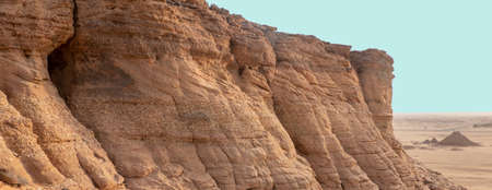 Exploration in a sandstone rock with a slope layer and intermediate banks of conglomerate, deposited...