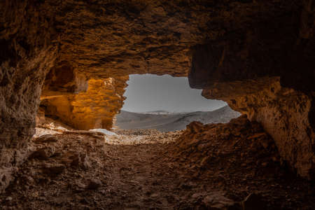 View from a cave entrance in the rocky desert of Sudanの写真素材