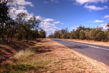 A hot dry outback road in rural NSW, Australiaの写真素材
